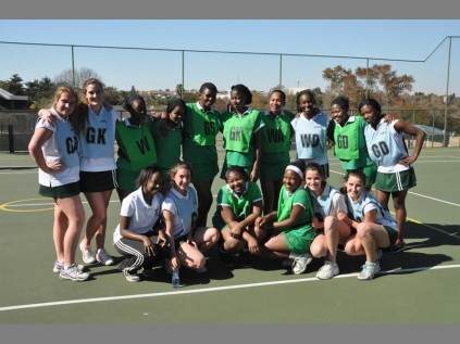 Focused... Brescia House School and Oprah Winfrey Academy girls strike a pose on the court before commencing their match.