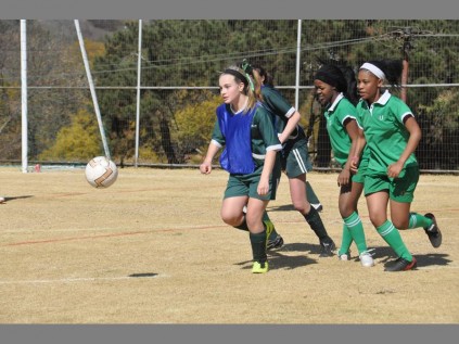 Strong competition... Girls from Brescia House School and the Oprah Winfrey Academy compete in a game of soccer.