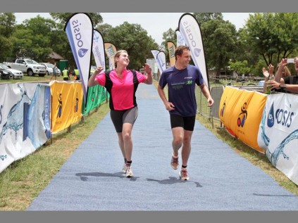 All smiles... Chantelle and Francois Strydom of Morningside head for the finish line in the first race in the new X-DIRT Triathlon Challenge at Buffelspoort Dam, in the Northwest Province on 1 December. Showing that the event can be a fun, family affair the couple competed in the on road section of the event and finished the 600m swim, 20km cycle and 5km run legs together in 2:15:43.