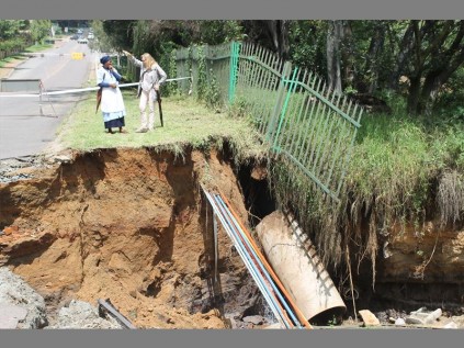 Shocking… Riverclub residents stand around the collapsed bridge.