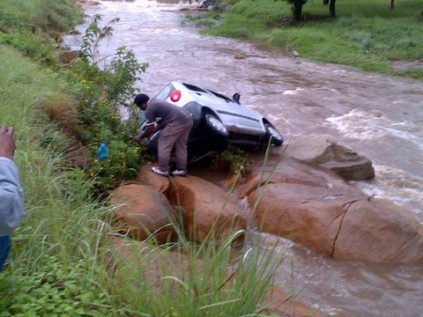 Washed away… A vehicle ends up in the Braamfontein Spruit. 
