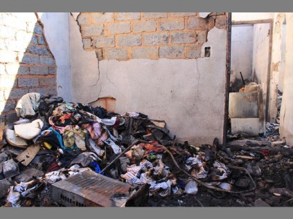 Collapsed... Jeffery Mahlangu's home after it was burnt to the ground in a suspected petrol bombing.