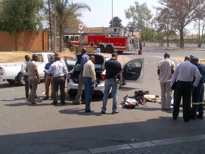 Police do a forensic sweep on the stolen goods and vehicle.