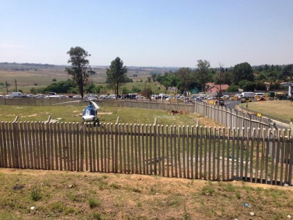 @GiaNicolaides: #N1Shooting Dozens of armed police officers, helicopter near Cell C building. #N1Shooting www.twitter.com