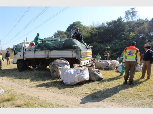 Clean up... Metro remove rubbish from the park in trucks.