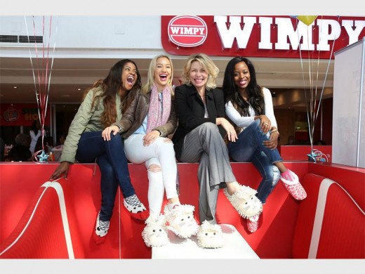 Kamohelo Bombe, TV presenter; Roxy Burger; TV personality, Ashleigh Hayden TV personality; and Tshepiso Mabulane, YFM producer and presenter, respectively show their support during a previous Slipper Day.