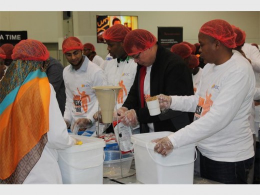 Assembly... An assembly of amazing workers from the IDC pack food.