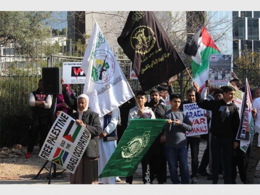 Nearly 100 anti-Israeli demonstrators gather on West Street on 1 July to voice their opinions.