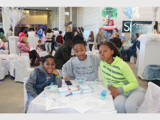 PLAY AND FUN: Maru and Nala Ziqubu with Tshepiso Mthebu enjoy the fun at the Winter Wonderland event.