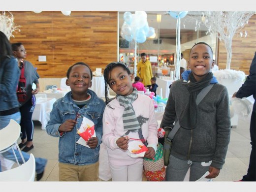 HAVE A BLAST: Lekau Mamabolo with Matabo and Malose Kekana at the Winter Wonderland event at Cedar Square.
