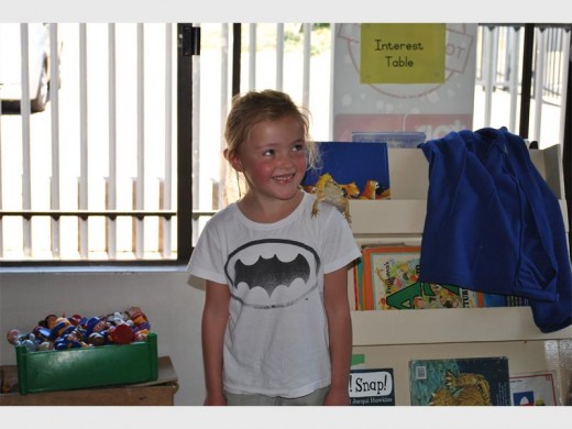 Sophie Spence poses with a bearded dragon.