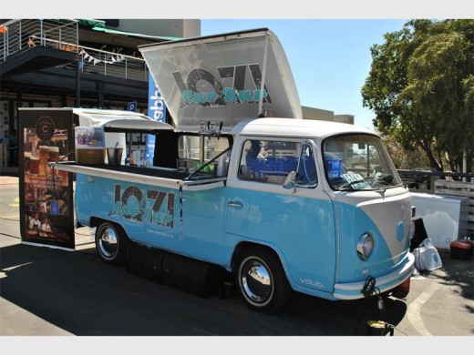 The Jozi Car Bar serves a variety of drinks and plays music.