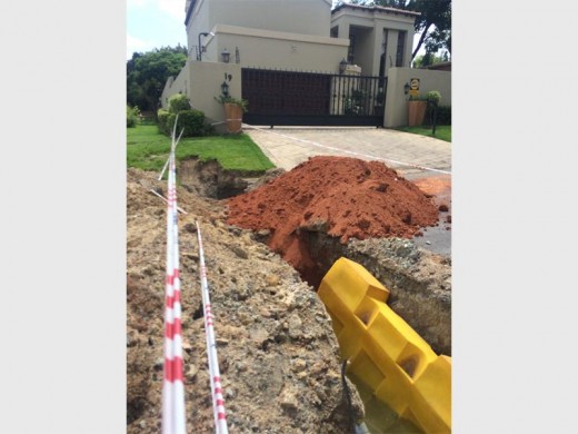 A photograph taken on 26 October showing that the pothole is now a massive trench resulting in a road closure.