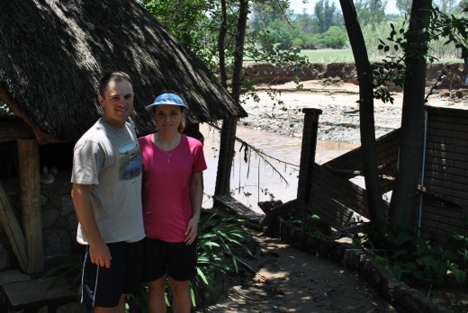 Derik and Riekie Swanepoel in front of the wall that was washed away.