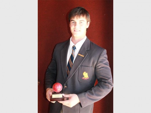 Andrew Ingman with his award for taking five wickets in an innings.