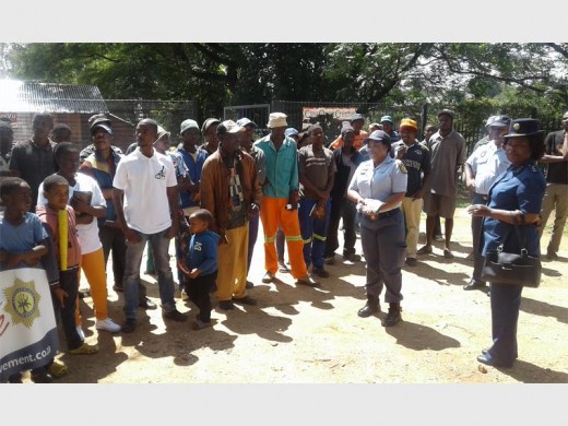 The police interact with community members at the launch of the 16 Days of Activism for no Violence Against Women and Children.