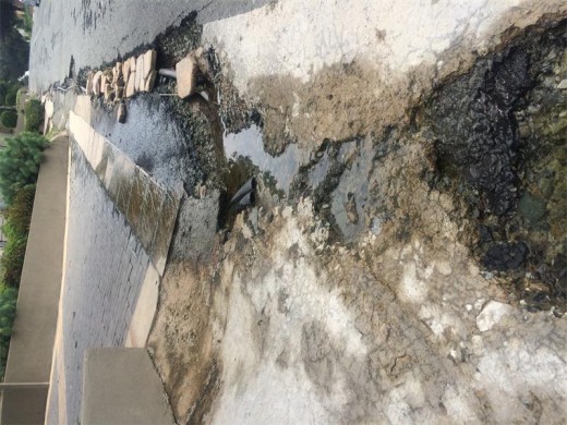 Water gathers along Victoria Avenue, next to an exposed Eskom cable.