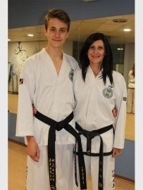 Tristan Hayman receives his first Dan black belt in Taekwondo. Pictured with him is coach, Sonya Rebelo.