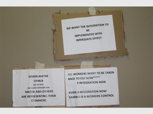Some of the placards with messages that show workers' support of the mayor's announcement.